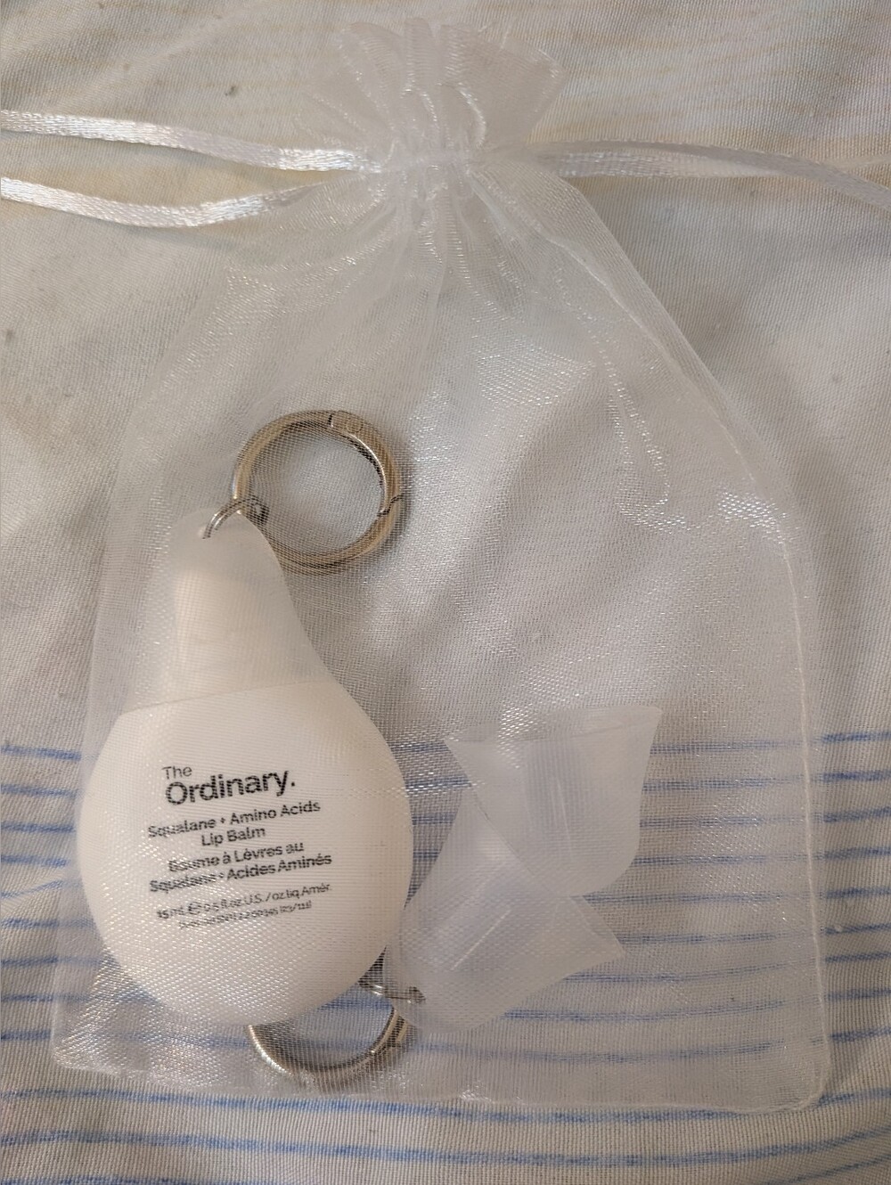 The Ordinary White Silicone Squalane + Amino Acids Lip Balm Keychain